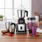 Moonstruck black 1000W juicer mixer grinder with 4 stainless steel jars and a smoothie in a glass.